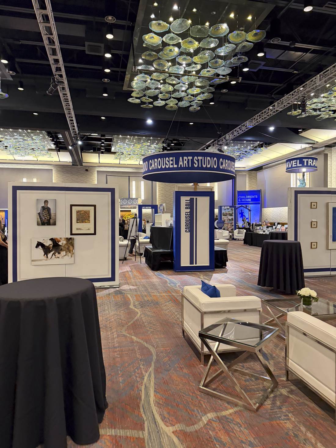 Standing display walls exhibiting donated art