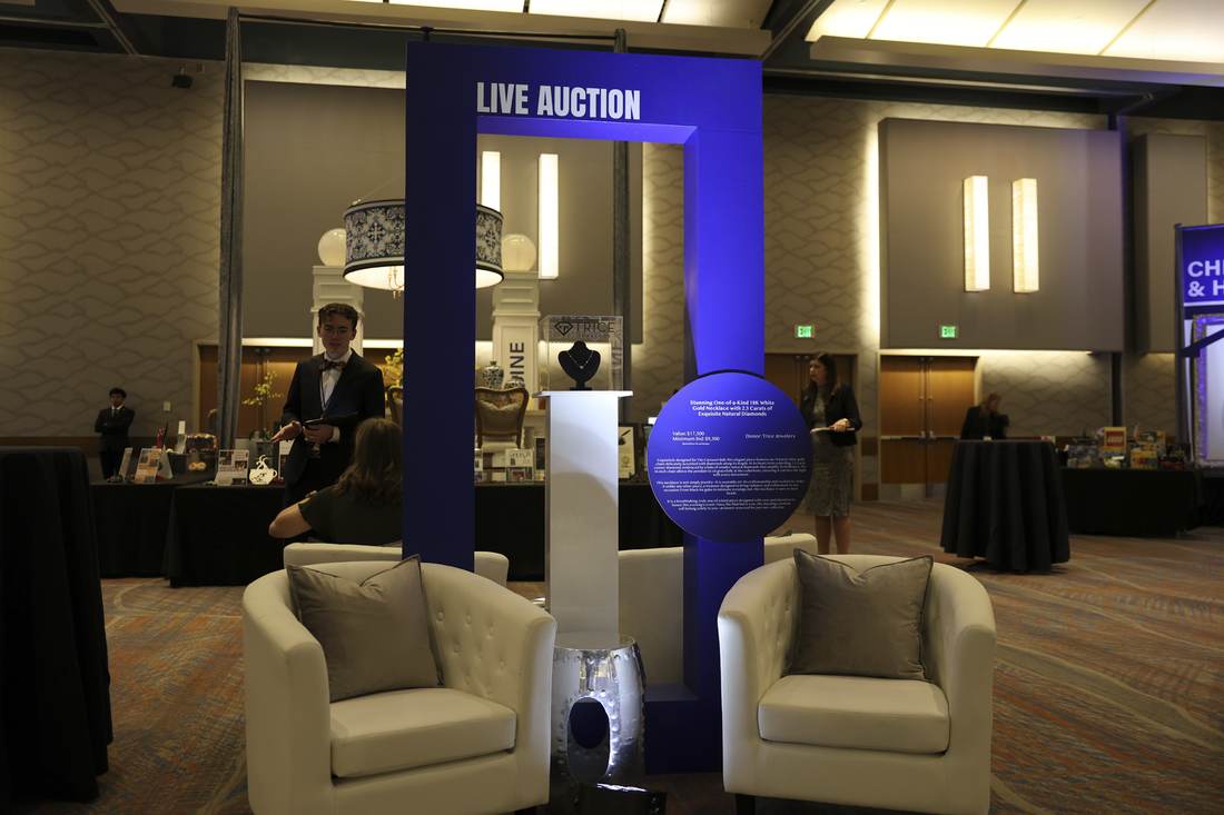 Live auction display for a diamond necklace donated by Trice Jewelers