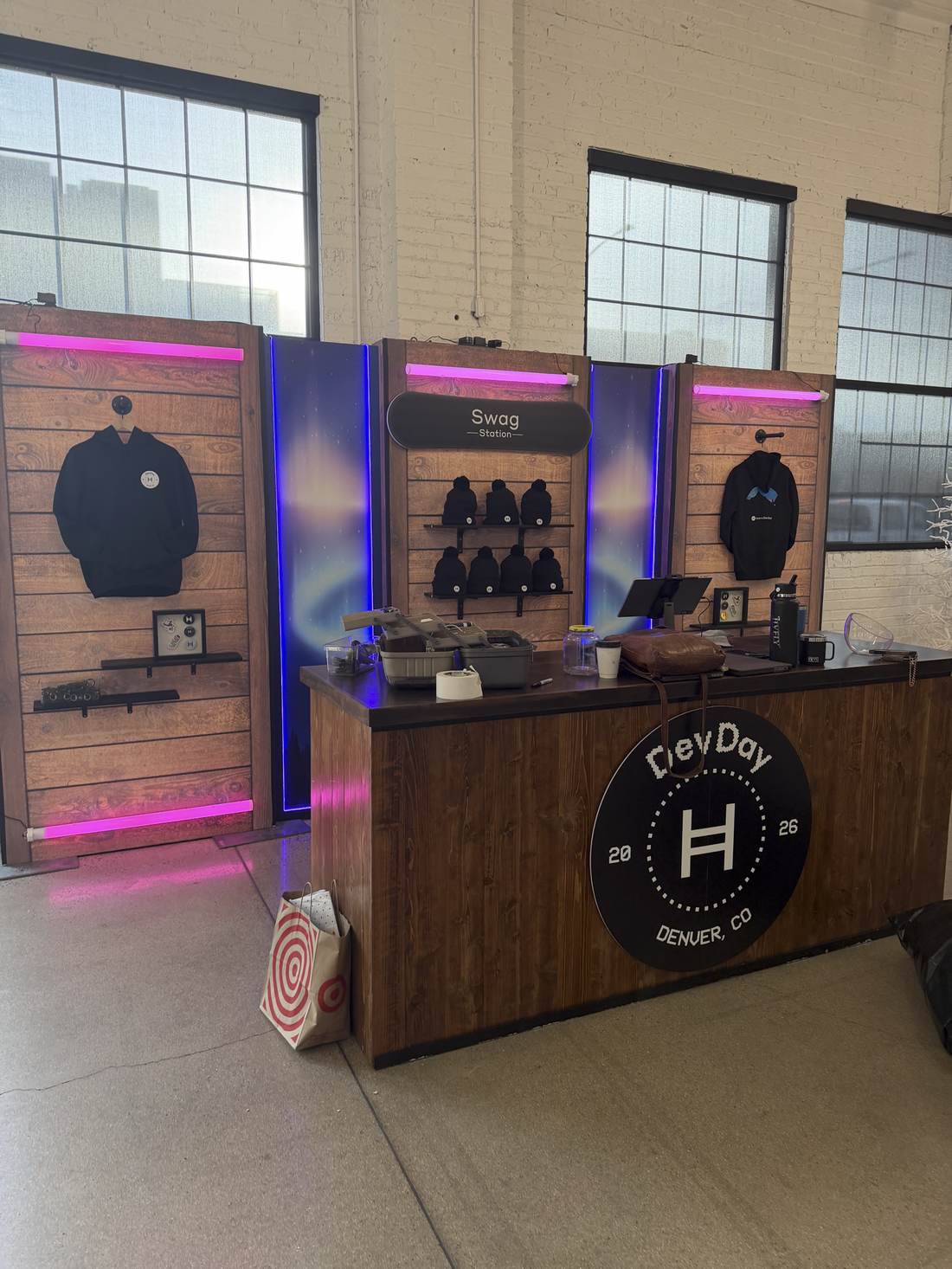 Full swag station with merch counter and DevDay logo