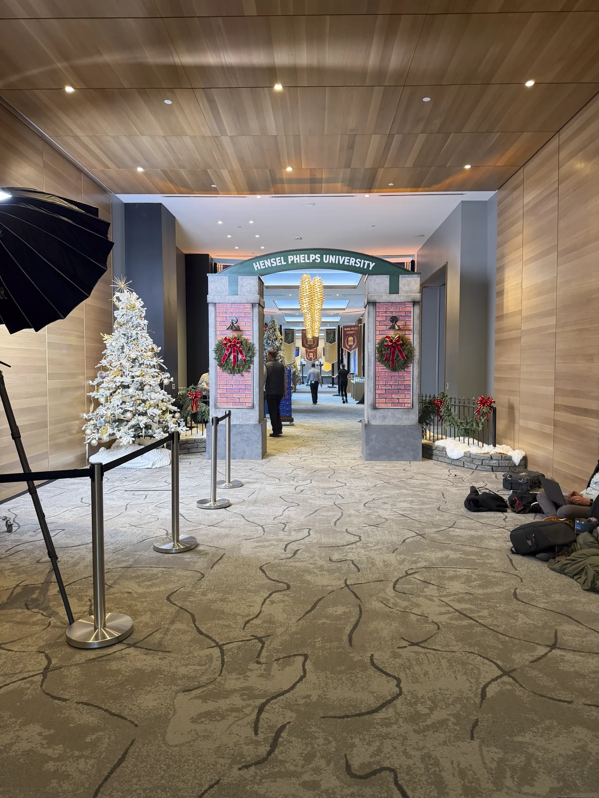 The archway seen down the hallway, flanked by holiday trees
