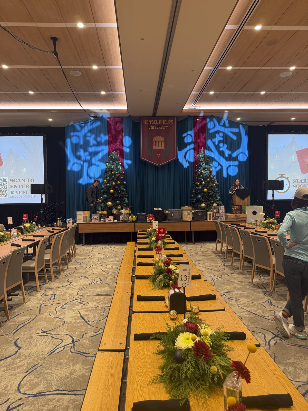 Main ballroom stage backdrop carrying the university crest