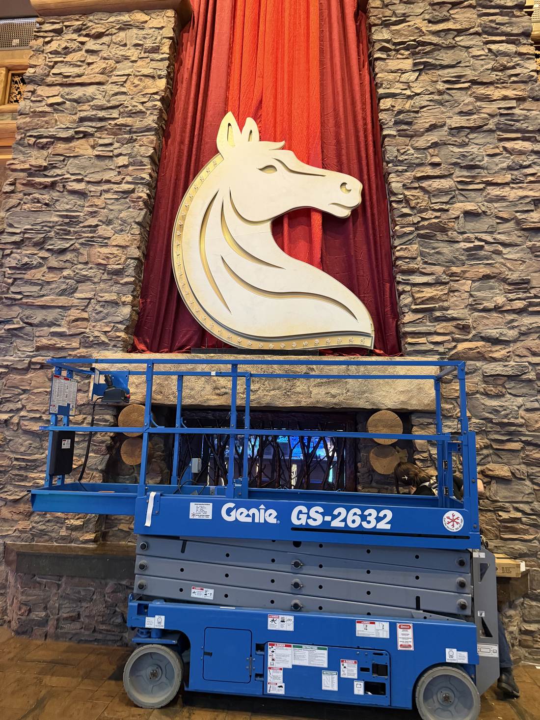 Installing the panel on the stone mantel with a lift
