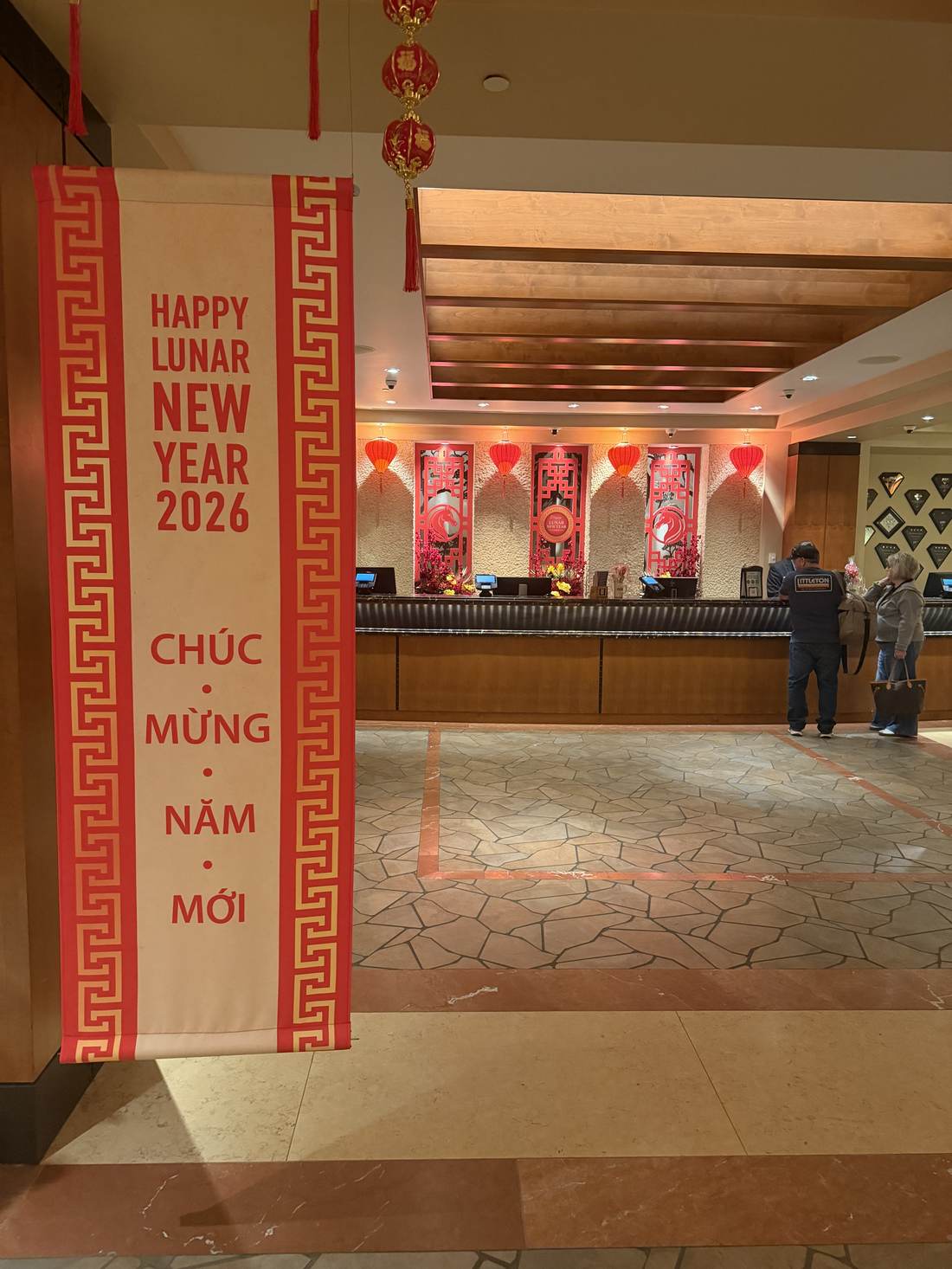 Close detail of the bilingual Happy Lunar New Year banner
