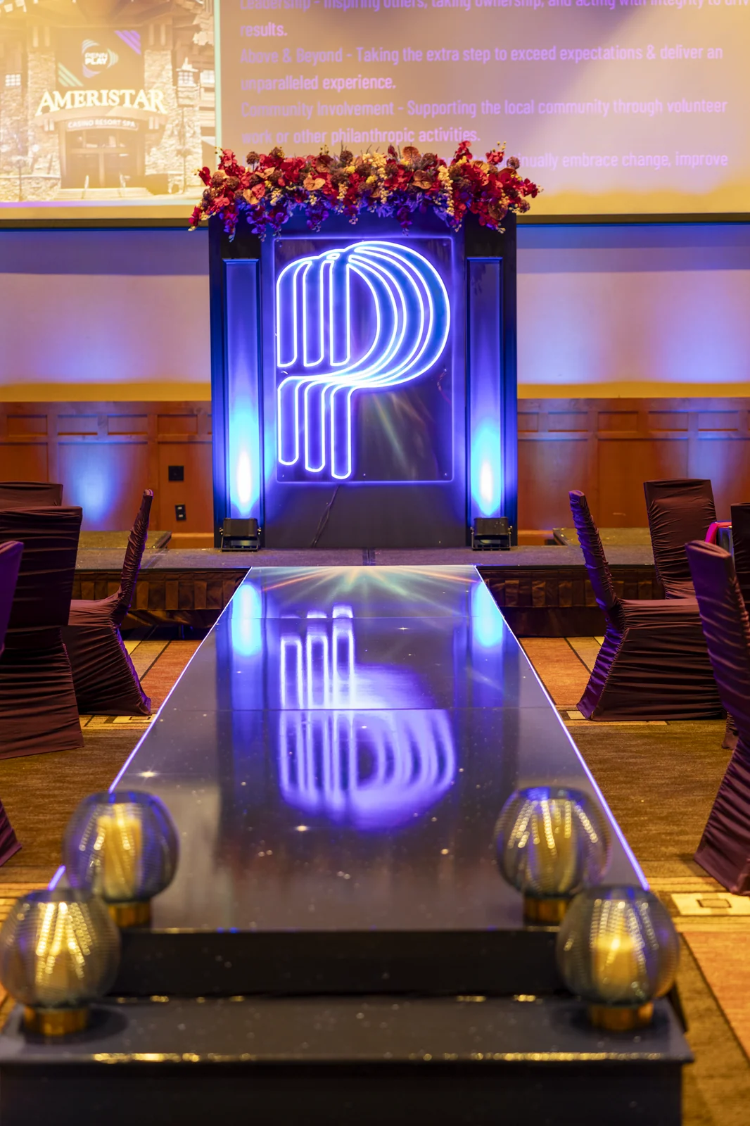 Lit monogram and mirrored runway