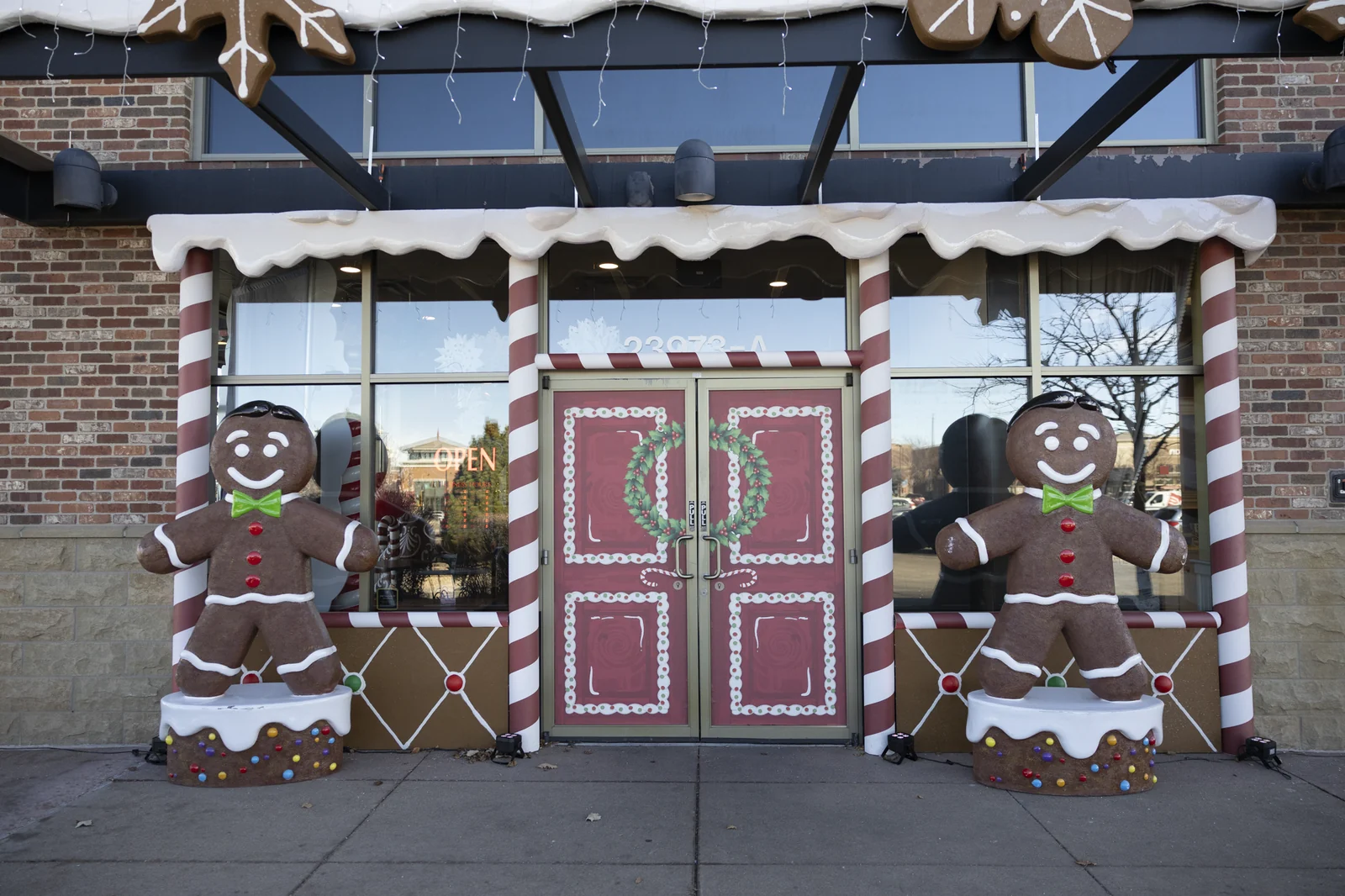 Gingerbread men flanking the doors