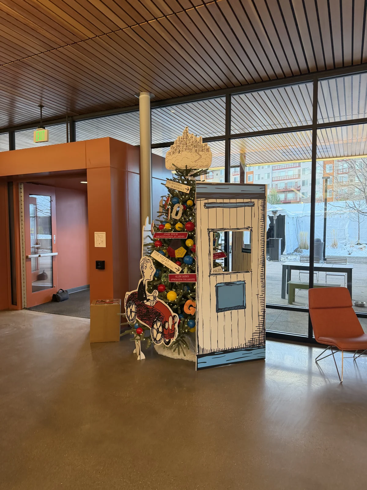 Library tree beside the phone booth