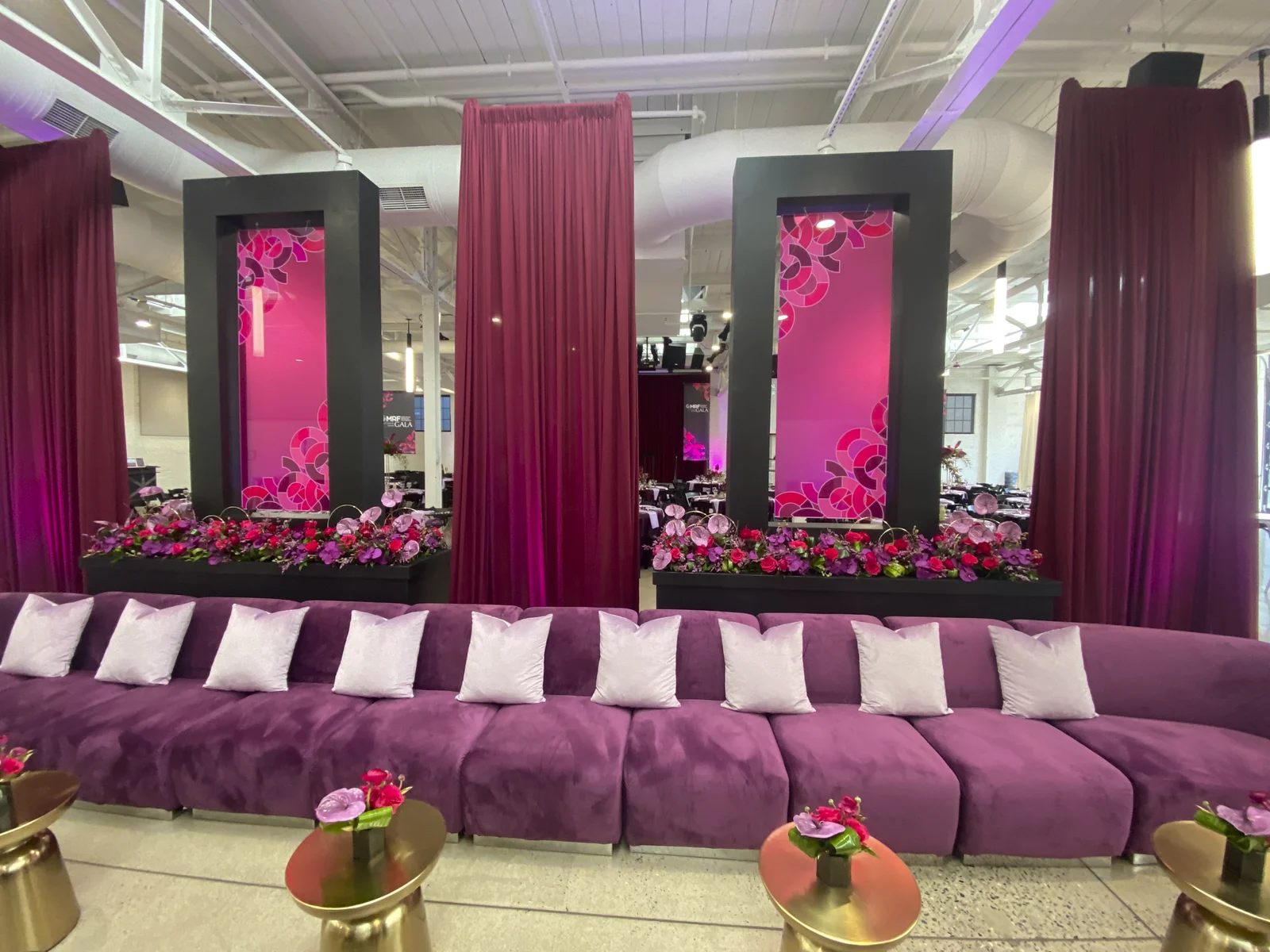 Close view of the printed plexiglass panels with the layered petal motif, backed by florals