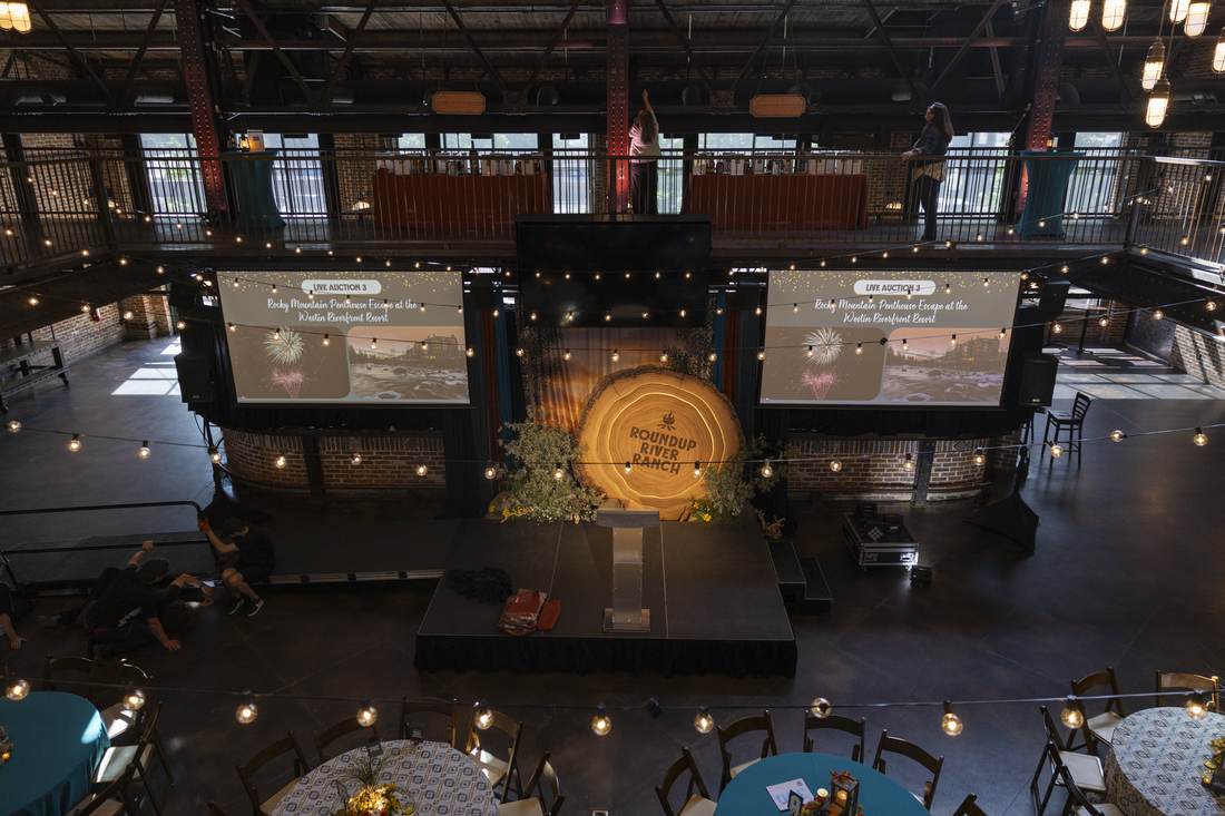 Overhead view of the full stage with live-auction screens