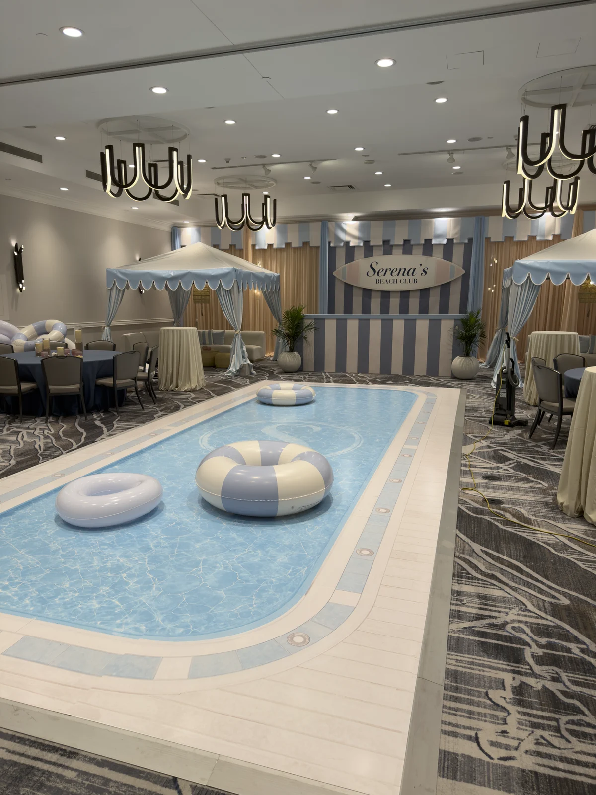Close view of the printed pool dance floor with pastel pool floats