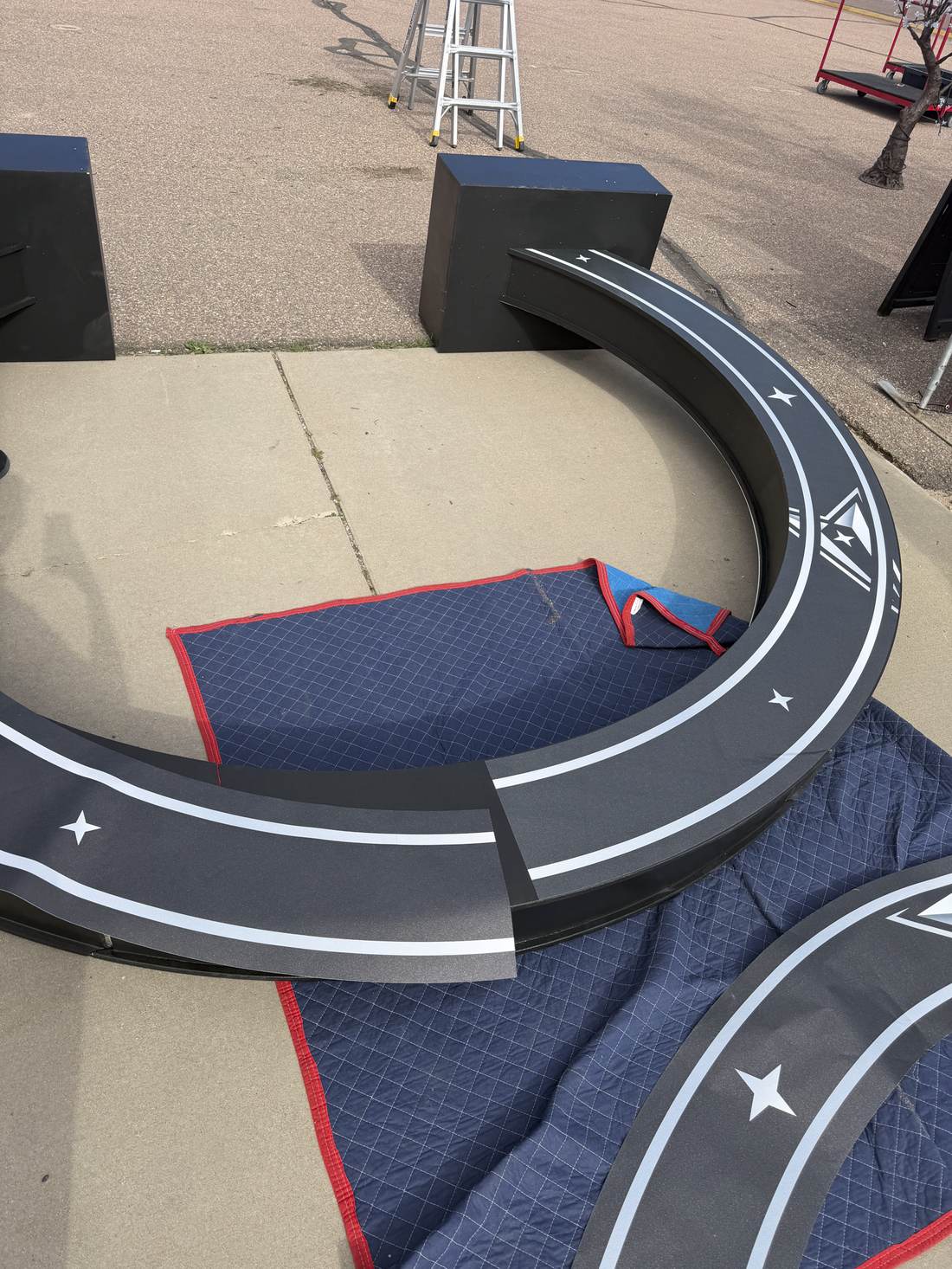 Flat-packed CNC-cut archway panels laid out before assembly